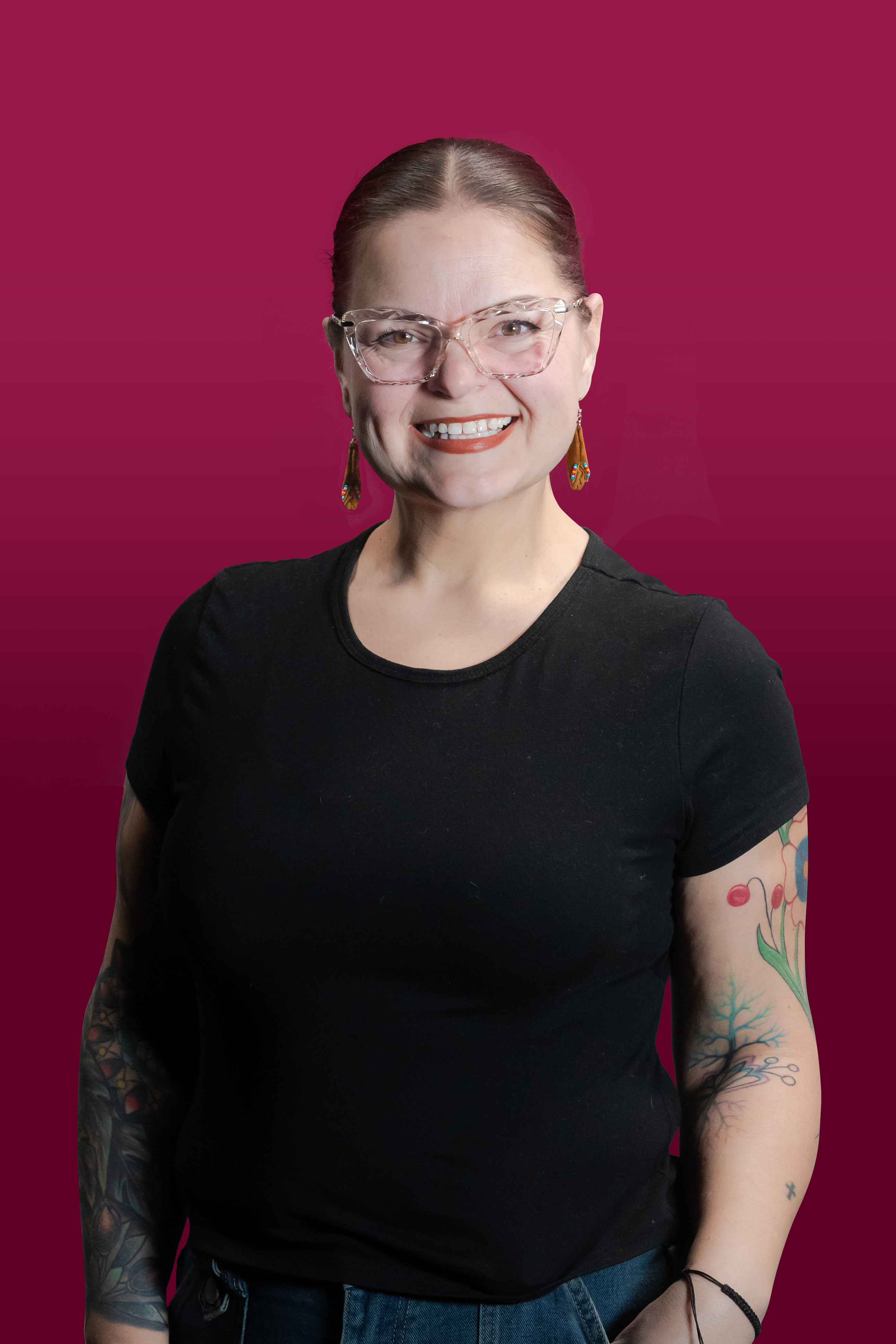 Ren Horst headshot against a maroon background.